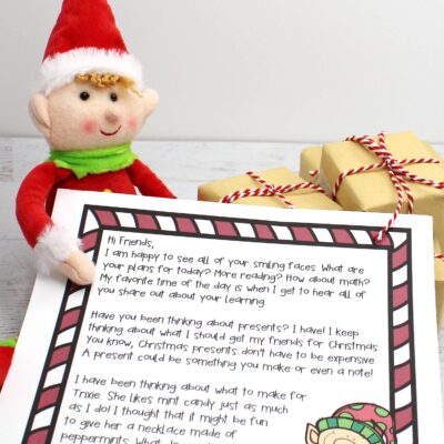 A classroom elf holding a printable note